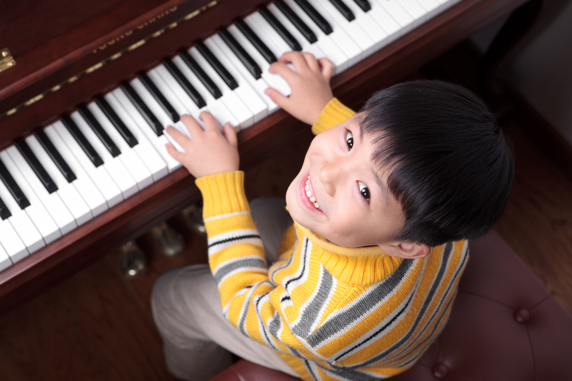 Little boys playing the piano